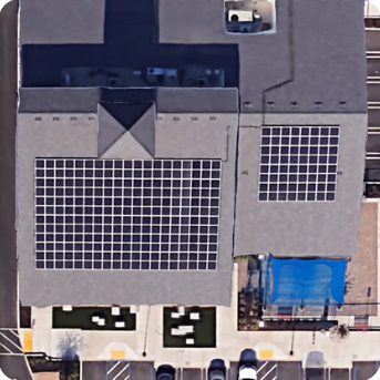 Aerial view of the Self Help Credit Union branch with installed solar arrays