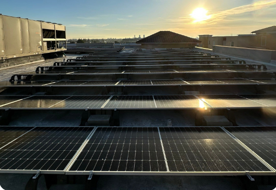 Sunset view across the La Clinica rooftop solar installation